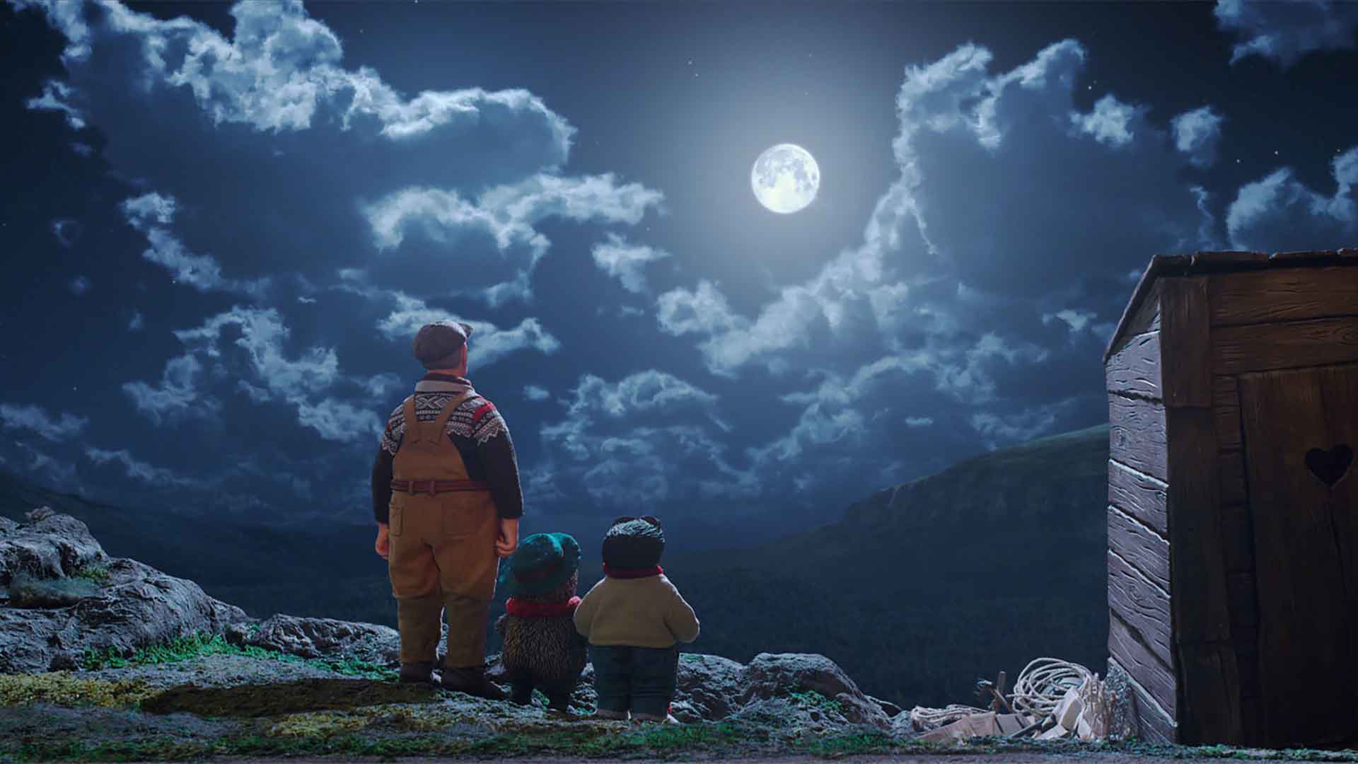 Un adulte et deux animaux regardent la lune